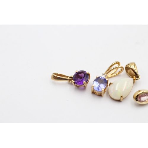 1080 - 4 X 9ct Gold Gemstone Set Pendants Inc. Opal, Pink Sapphire, Tanzanite & Amethyst (2.1g)