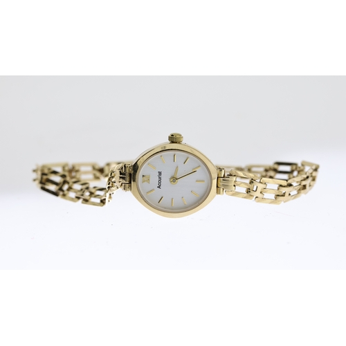 282 - LADIES ACCURIST 9CT GOLD COCKTAIL WATCH W/BOX & PAPERS, approx 14mm silver dial with baton hour mark... 