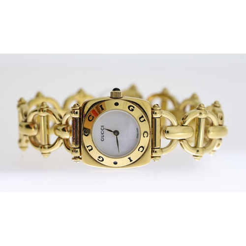 348 - LADIES GUCCI REF 6400L W/BOX, approx 20mm mother of pearl dial, gold plated outer bezel and case, li... 