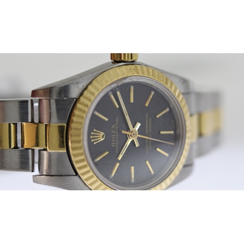 71 - LADIES ROLEX OYSTER PERPETUAL REFERENCE 76193, black dial with gold baton hour markers, fluted bezel... 