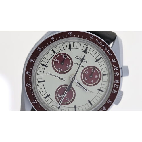 98 - OMEGA MOONSWATCH SPEEDMASTER MISSION TO PLUTO WITH BOX,  grey blue case, burgundy detail and strap q... 