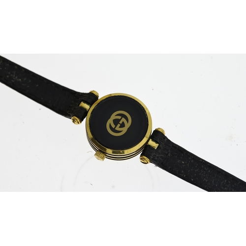 346 - LADIES GUCCI W/BOX, approx 20mm black dial, gold plated bezel, Gucci crown and case, black leather s... 