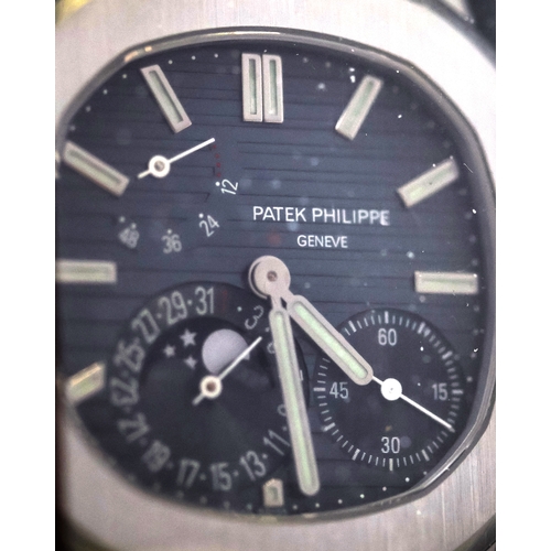 50 - SEALED PATEK PHILIPPE NAUTILUS CALENDAR MOON PHASE REFERENCE 5712/1A WITH BOX AND PAPERS, This iconi... 