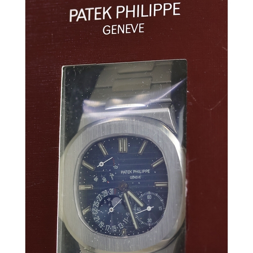 50 - SEALED PATEK PHILIPPE NAUTILUS CALENDAR MOON PHASE REFERENCE 5712/1A WITH BOX AND PAPERS, This iconi... 