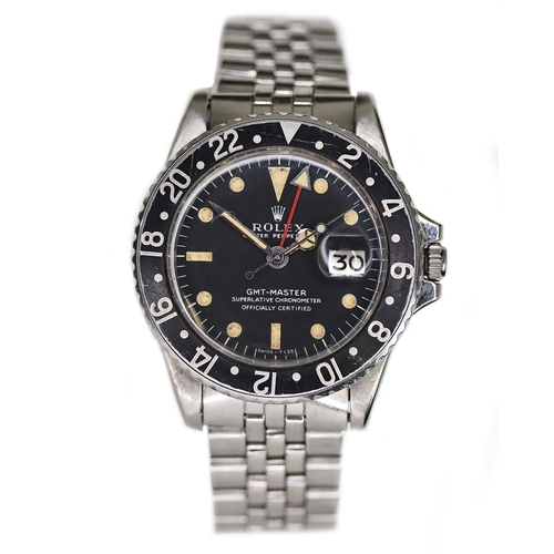 58 - ROLEX GMT MASTER REFERENCE 1675 CIRCA 1969, circular matte black dial with patina hour markers, merc... 