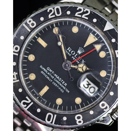 58 - ROLEX GMT MASTER REFERENCE 1675 CIRCA 1969, circular matte black dial with patina hour markers, merc... 