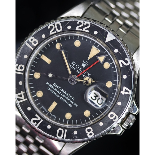 58 - ROLEX GMT MASTER REFERENCE 1675 CIRCA 1969, circular matte black dial with patina hour markers, merc... 