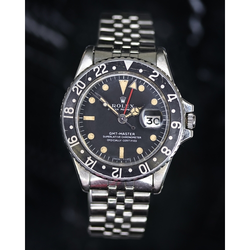 58 - ROLEX GMT MASTER REFERENCE 1675 CIRCA 1969, circular matte black dial with patina hour markers, merc... 