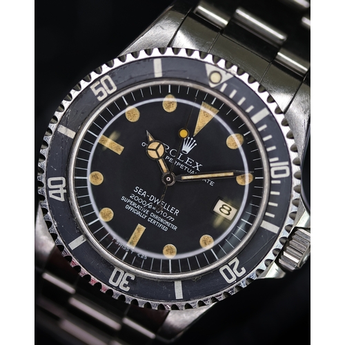 76 - RARE ROLEX SEA DWELLER 'RAIL DIAL' REFERENCE 1665 CIRCA 1978, circular matte black dial with pumpkin... 