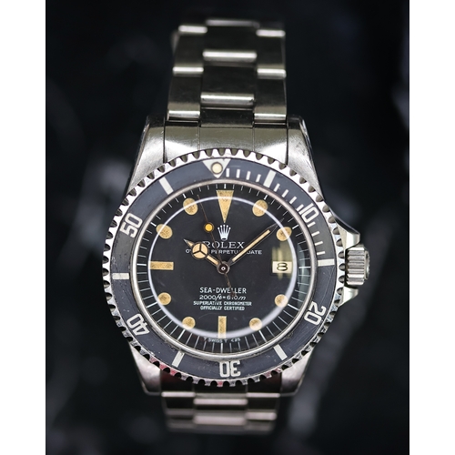 76 - RARE ROLEX SEA DWELLER 'RAIL DIAL' REFERENCE 1665 CIRCA 1978, circular matte black dial with pumpkin... 