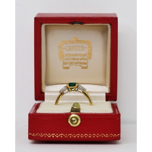 89 - CARTIER EMERALD AND DIAMOND RING, central oval cut emerald, flanked by a pair of pear cut diamonds, ... 