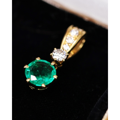 90 - CARTIER EMERALD AND DIAMOND PENDANT, feature round cut emerald, suspended from a brilliant cut diamo... 