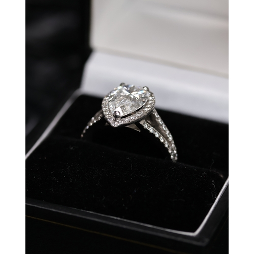 92 - FINE 2.34CT PEAR CUT DIAMOND CLUSTER RING, central pear cut diamond with a brilliant cut diamond boa... 