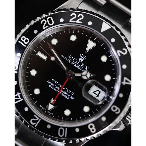 81 - ROLEX GMT MASTER II REFERENCE 16710 CIRCA 2002, circular gloss black dial with applied hour markers,... 