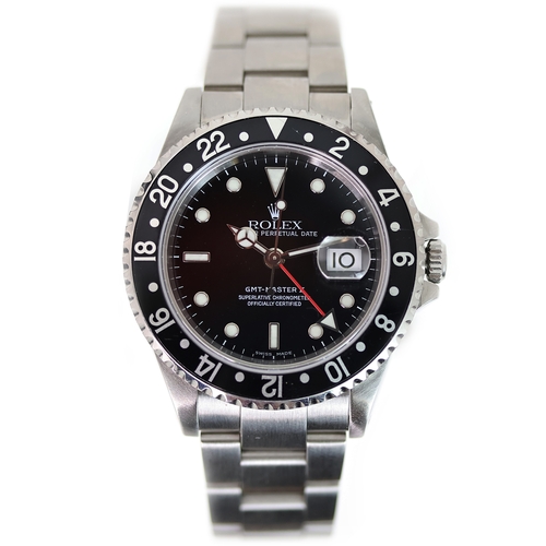 84 - ROLEX GMT MASTER II REFERENCE 16710 CIRCA 2001, circular gloss black dial with applied hour markers,... 