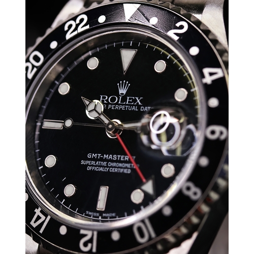 84 - ROLEX GMT MASTER II REFERENCE 16710 CIRCA 2001, circular gloss black dial with applied hour markers,... 