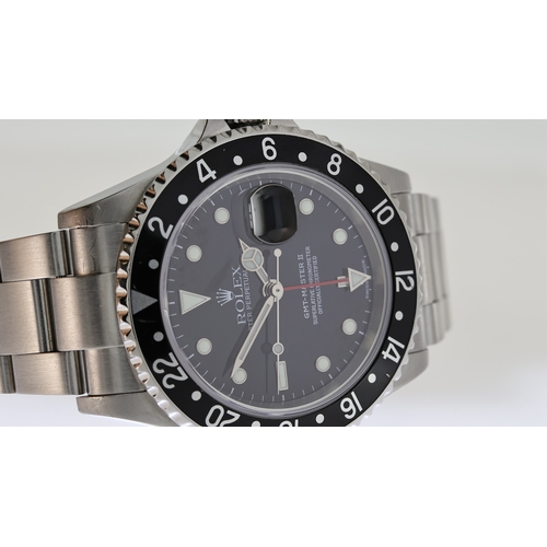 38 - ROLEX GMT MASTER II REFERENCE 16710 CIRCA 2001, circular gloss black dial with applied hour markers,... 