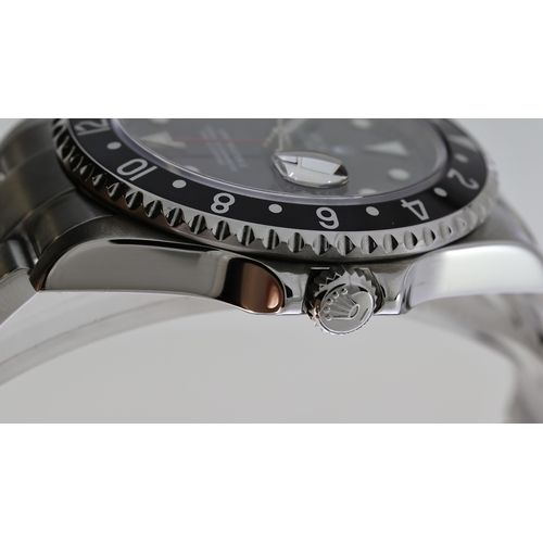 38 - ROLEX GMT MASTER II REFERENCE 16710 CIRCA 2001, circular gloss black dial with applied hour markers,... 