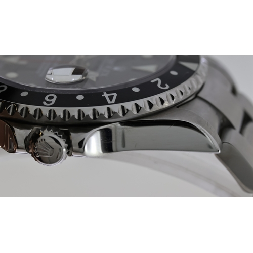 38 - ROLEX GMT MASTER II REFERENCE 16710 CIRCA 2001, circular gloss black dial with applied hour markers,... 