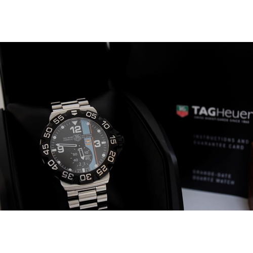 9 - TAG HEUER FORMULA 1 GULF EDITION REFERENCE WAH1013 BOX AND PAPERS 2011, circular black hashed dial w... 