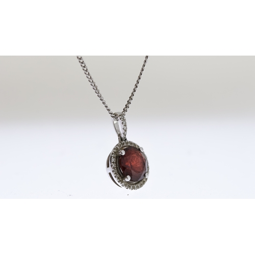 1025 - 9ct Garnet and diamond pendant with chain