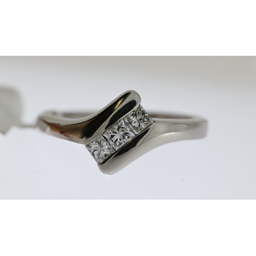 1027 - Diamond 3 stone ring 0.30ct, 18ct white gold, tension set, estimated 0.25-0.30ct, ring size L