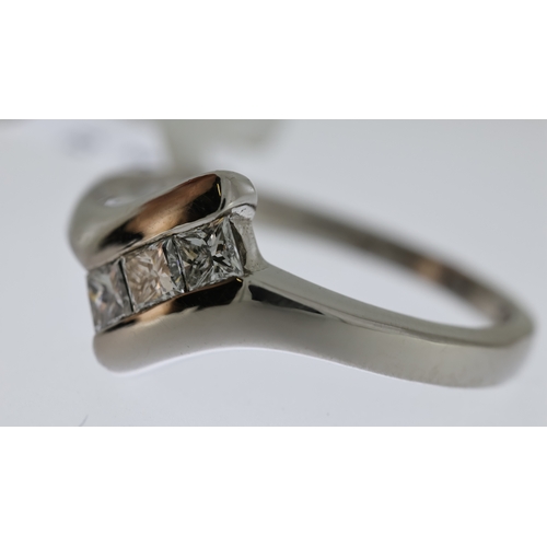 1027 - Diamond 3 stone ring 0.30ct, 18ct white gold, tension set, estimated 0.25-0.30ct, ring size L