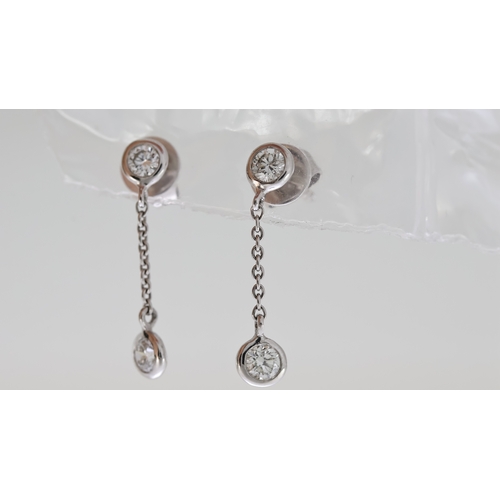 1028 - 18ct Diamond Drop Earrings, 2 feature Brilliant cut diamonds, fine trace link chain, 18ct white gold... 