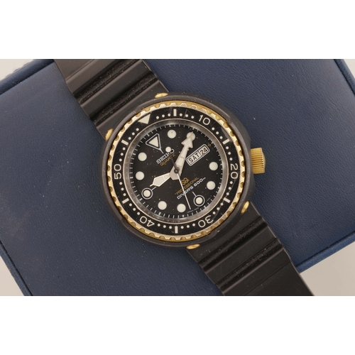 224 - SEIKO TUNA, circular black dial with hour markers and hands, case with a crown and a case back, insi... 