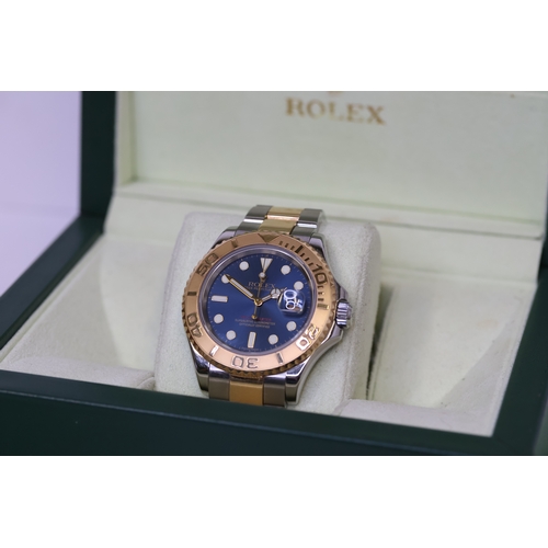 52 - ROLEX YACTHMASTER 40 STEEL AND GOLD 16623 BOX AND PAPERS 2007, circular sunburst blue dial with gold... 