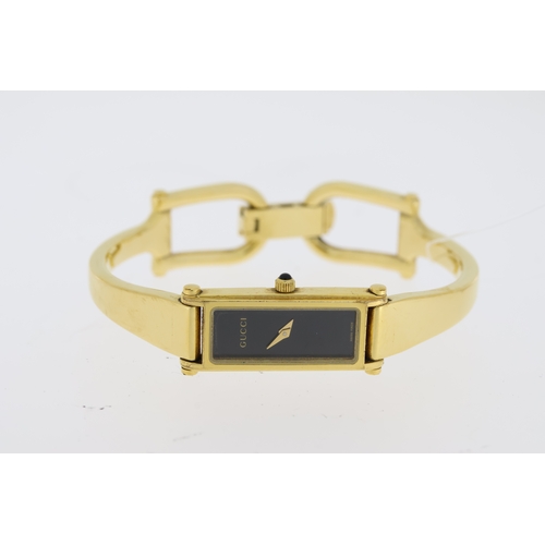 219 - LADIES GUCCI QUARTZ WATCH 1500L WITH BOX,  rectangular black dial, gold plated bangle watch, quartz ... 