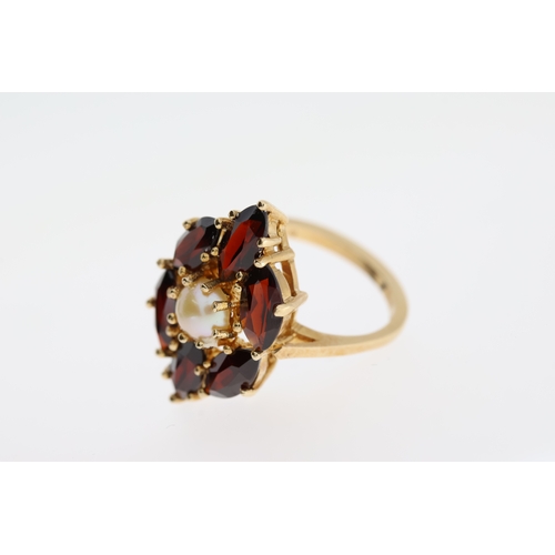 1043 - Fine 14ct Gold Garnet and Cultured Pearl RingFully hallmarked for 14ct Gold set with Marquis shaped ... 