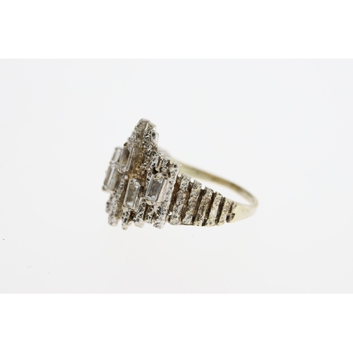 1044 - Vintage modernist white metal and spinel ring. Set in white metal with baguette cut spinels . The he... 