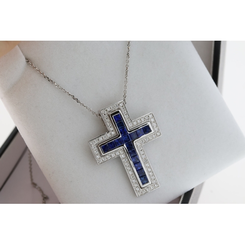 1059 - 18ct white gold two piece cross pendant set with square calibre-cut sapphires and RBC diamonds on a ... 