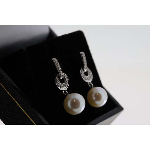 1063 - Pair of 9ct white gold diamond and pearl drop earrings, boxed. Diamonds 0.16ct