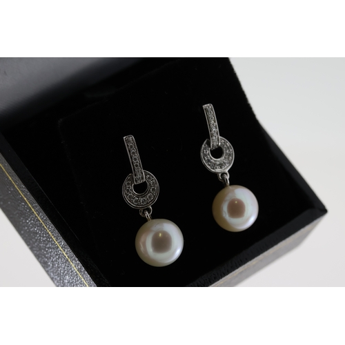 1063 - Pair of 9ct white gold diamond and pearl drop earrings, boxed. Diamonds 0.16ct