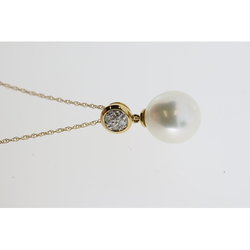 1066 - 9k yellow gold pearl and diamond bale necklace. Diamonds 0.08ct