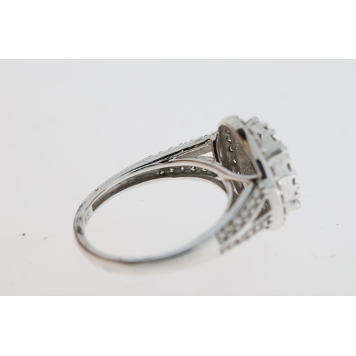 1068 - Large 9ct white gold diamond cluster ring with diamond-set shoulders. RBC diamonds 1.00ct