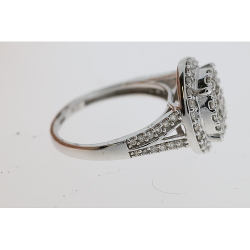 1068 - Large 9ct white gold diamond cluster ring with diamond-set shoulders. RBC diamonds 1.00ct