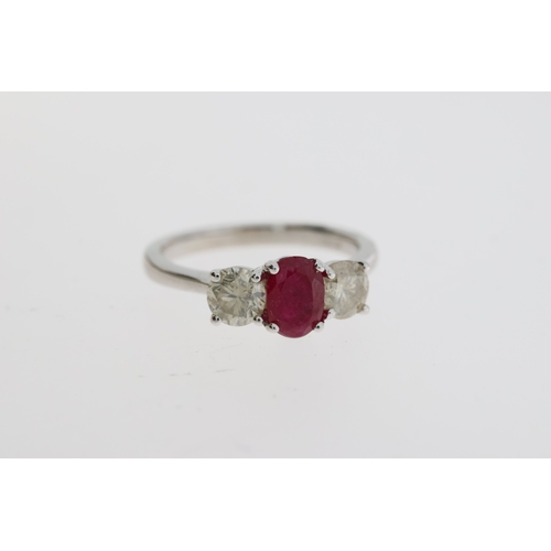 1071 - Certificated 18ct white gold trilogy ring set with an oval ruby flanked by RBC diamonds. Ruby 1.10ct... 