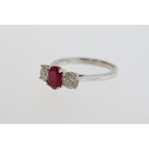 1071 - Certificated 18ct white gold trilogy ring set with an oval ruby flanked by RBC diamonds. Ruby 1.10ct... 