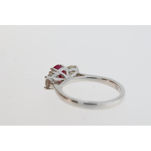 1071 - Certificated 18ct white gold trilogy ring set with an oval ruby flanked by RBC diamonds. Ruby 1.10ct... 