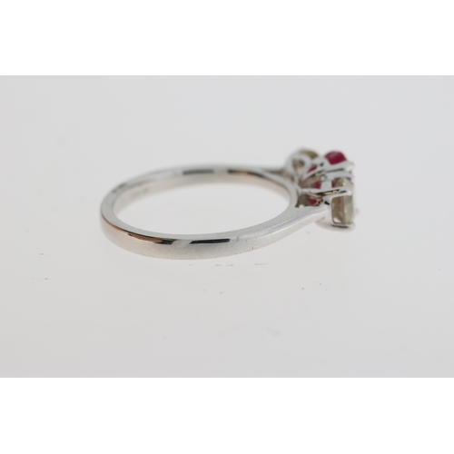 1071 - Certificated 18ct white gold trilogy ring set with an oval ruby flanked by RBC diamonds. Ruby 1.10ct... 