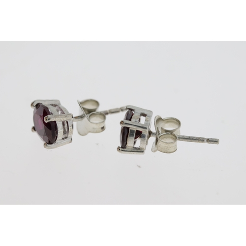 1073 - Pair of rhodolite garnet studs in silver