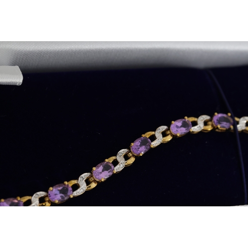 1076 - 9ct yellow gold amethyst and diamond figure-of-eight bracelet, boxed. Oval-cut amethysts 5.50ct appr... 