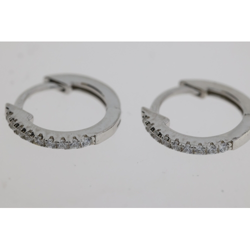 1083 - Pair of silver hoop earrings set with white cubic zirconia