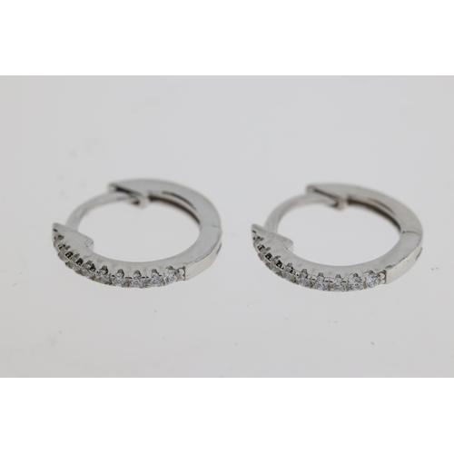 1083 - Pair of silver hoop earrings set with white cubic zirconia