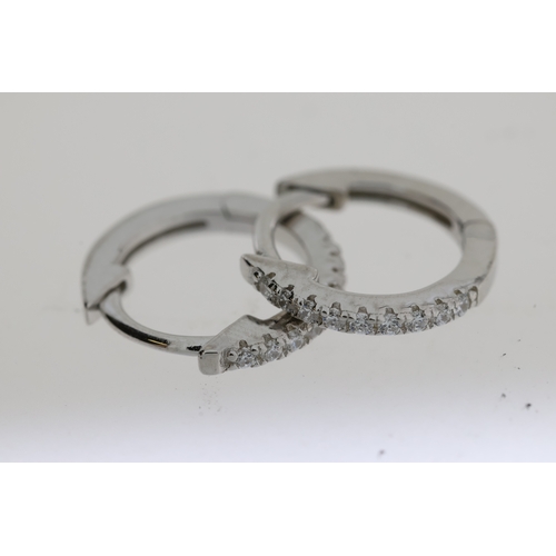 1083 - Pair of silver hoop earrings set with white cubic zirconia