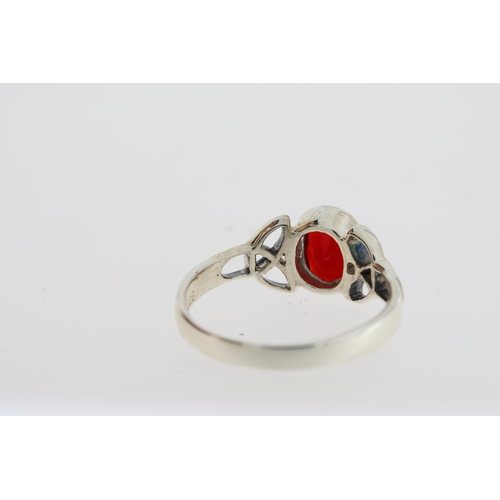 1086 - Silver celtic-style ring set with oval red CZ