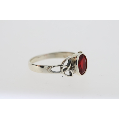 1086 - Silver celtic-style ring set with oval red CZ